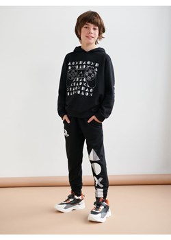 Sinsay - Spodnie dresowe jogger PlayStation - czarny ze sklepu Sinsay w kategorii Spodnie chłopięce - zdjęcie 169254849