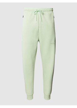 Spodnie dresowe z elastycznym pasem model ‘Hadiko’ ze sklepu Peek&Cloppenburg  w kategorii Spodnie męskie - zdjęcie 169255145