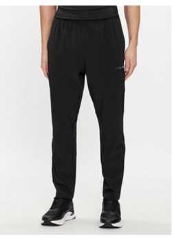 Calvin Klein Performance Spodnie dresowe 00GMS4P633 Czarny Regular Fit ze sklepu MODIVO w kategorii Spodnie męskie - zdjęcie 169287427
