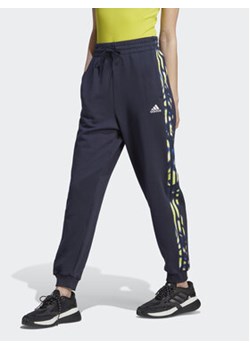 adidas Spodnie dresowe IL5863 Niebieski Loose Fit ze sklepu MODIVO w kategorii Spodnie damskie - zdjęcie 169373558