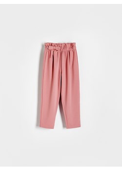 Reserved - Dzianinowe spodnie z kokardką - brudny róż ze sklepu Reserved w kategorii Spodnie i półśpiochy - zdjęcie 169389235