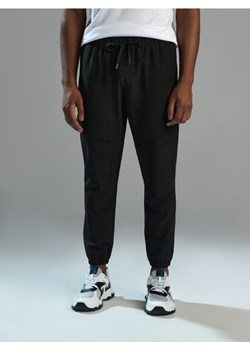 Sinsay - Spodnie dresowe SNSY PERFORMANCE - czarny ze sklepu Sinsay w kategorii Spodnie męskie - zdjęcie 169455876