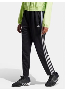 adidas Spodnie dresowe Train Essentials HZ5646 Czarny Loose Fit ze sklepu MODIVO w kategorii Spodnie damskie - zdjęcie 169491447