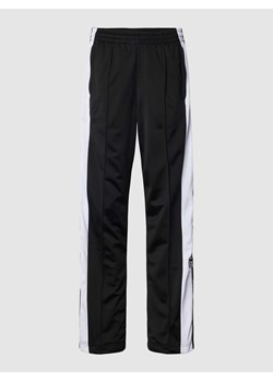Spodnie dresowe z bocznymi listwami na zatrzaski model ‘ADIBREAK’ ze sklepu Peek&Cloppenburg  w kategorii Spodnie damskie - zdjęcie 169558296