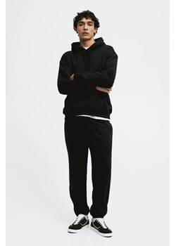 H & M - Spodnie dresowe Relaxed Fit - Czarny ze sklepu H&M w kategorii Spodnie męskie - zdjęcie 169594685