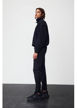 H & M - Zwężane joggersy techniczne z kieszeniami DryMove - Czarny ze sklepu H&M w kategorii Spodnie męskie - zdjęcie 169599186