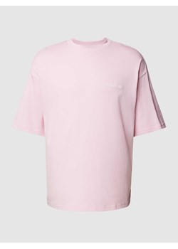 T-shirt o kroju oversized z nadrukiem z logo ze sklepu Peek&Cloppenburg  w kategorii T-shirty męskie - zdjęcie 169631228