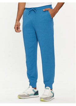 United Colors Of Benetton Spodnie dresowe 3J68UF00K Niebieski Regular Fit ze sklepu MODIVO w kategorii Spodnie męskie - zdjęcie 169634615