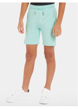 Calvin Klein Jeans Szorty sportowe Minimalistic IB0IB02061 Niebieski Regular Fit ze sklepu MODIVO w kategorii Spodenki chłopięce - zdjęcie 169635946