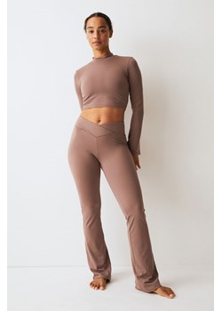 H & M - Rozszerzane legginsy sportowe SoftMove - Beżowy ze sklepu H&M w kategorii Spodnie damskie - zdjęcie 169675425