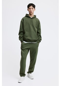 H & M - Spodnie dresowe Relaxed Fit - Zielony ze sklepu H&M w kategorii Spodnie męskie - zdjęcie 169681358