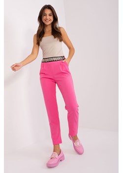 Różowe spodnie z materiału z ozdobną gumką w pasie ze sklepu 5.10.15 w kategorii Spodnie damskie - zdjęcie 169684065
