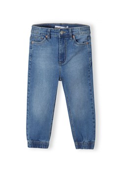 Jeansy o kroju joggerów z elastycznymi mankietami dla dziewczynki ze sklepu 5.10.15 w kategorii Spodnie dziewczęce - zdjęcie 169684099