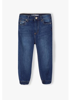 Spodnie jeansowe dla dziewczynki typu joggery - granatowe ze sklepu 5.10.15 w kategorii Spodnie dziewczęce - zdjęcie 169699737