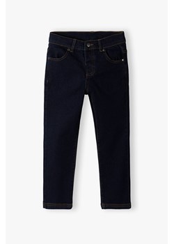 Jeansowe spodnie dziewczęce - granatowe ze sklepu 5.10.15 w kategorii Spodnie dziewczęce - zdjęcie 169699937