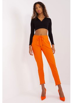 Spodnie basic z asymetrycznymi nogawkami pomarańczowy ze sklepu 5.10.15 w kategorii Spodnie damskie - zdjęcie 169701426