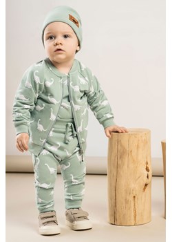 Spodnie dresowe baggy niemowlęce oliwkowe- białe dinozaury ze sklepu 5.10.15 w kategorii Spodnie i półśpiochy - zdjęcie 169710457