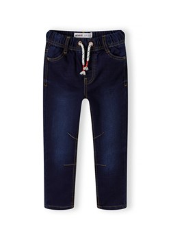 Ciemne jeansy ze ściągaczem oraz kieszeniami niemowlęce ze sklepu 5.10.15 w kategorii Spodnie i półśpiochy - zdjęcie 169722617