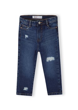 Ciemne jeansy o luźnym kroju dla dziewczynki z przetarciami ze sklepu 5.10.15 w kategorii Spodnie dziewczęce - zdjęcie 169730695