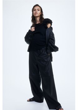 H & M - MAMA Dżersejowy top z falbankowym rękawem - Czarny ze sklepu H&M w kategorii Bluzki ciążowe - zdjęcie 169749119