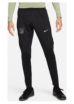 Męskie spodnie piłkarskie z dzianiny Nike Dri-FIT Atlético Madryt Strike (wersja trzecia) - Czerń ze sklepu Nike poland w kategorii Spodnie męskie - zdjęcie 169754436