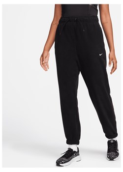 Damskie luźne spodnie z dzianiny Nike Therma-FIT - Czerń ze sklepu Nike poland w kategorii Spodnie damskie - zdjęcie 169754495