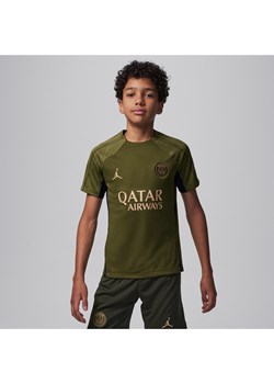 Dzianinowa koszulka piłkarska dla dużych dzieci Jordan Dri-FIT Paris Saint-Germain Strike (wersja czwarta) - Zieleń ze sklepu Nike poland w kategorii T-shirty chłopięce - zdjęcie 169754635