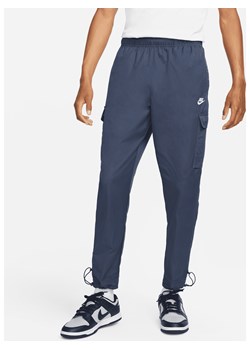 Męskie spodnie z tkaniny Nike Sportswear Repeat - Niebieski ze sklepu Nike poland w kategorii Spodnie męskie - zdjęcie 169754715