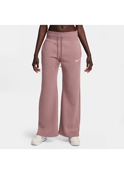 Damskie spodnie dresowe z wysokim stanem i szerokimi nogawkami Nike Sportswear Phoenix Fleece - Fiolet ze sklepu Nike poland w kategorii Spodnie damskie - zdjęcie 169754726