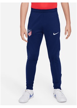 Spodnie piłkarskie z dzianiny dla dużych dzieci Atlético Madrid Strike Nike Dri-FIT - Niebieski ze sklepu Nike poland w kategorii Spodnie chłopięce - zdjęcie 169755236