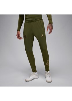 Męskie spodnie piłkarskie Jordan Dri-FIT Paris Saint-Germain Strike (wersja czwarta) - Zieleń ze sklepu Nike poland w kategorii Spodnie męskie - zdjęcie 169755296