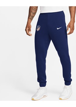 Męskie spodnie z dzianiny dresowej Nike Atlético Madryt - Niebieski ze sklepu Nike poland w kategorii Spodnie męskie - zdjęcie 169755539