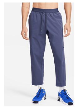 Nike A.P.S. Męskie uniwersalne spodnie z tkaniny Dri-FIT - Niebieski ze sklepu Nike poland w kategorii Spodnie męskie - zdjęcie 169755845