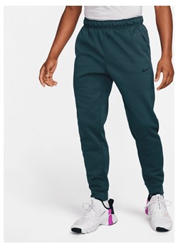 Męskie zwężane spodnie do fitnessu Therma-FIT Nike Therma - Zieleń ze sklepu Nike poland w kategorii Spodnie męskie - zdjęcie 169756638