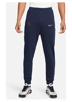 Męskie spodnie z dzianiny dresowej Nike Football Paris Saint-Germain - Niebieski ze sklepu Nike poland w kategorii Spodnie męskie - zdjęcie 169757085
