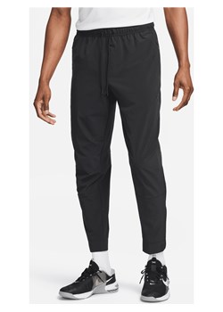 Męskie uniwersalne spodnie ze ściągaczami i zamkami Dri-FIT Nike Unlimited - Czerń ze sklepu Nike poland w kategorii Spodnie męskie - zdjęcie 169757339