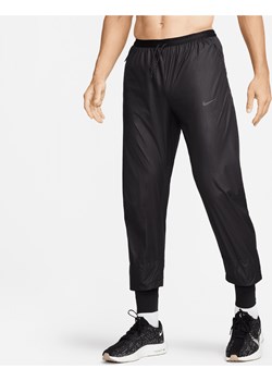 Męskie spodnie do biegania Storm-FIT Nike Running Division Phenom - Czerń ze sklepu Nike poland w kategorii Spodnie męskie - zdjęcie 169758166