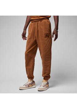 Męskie spodnie zimowe z dzianiny Jordan Essentials - Brązowy ze sklepu Nike poland w kategorii Spodnie męskie - zdjęcie 169758175