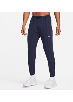 Męskie spodnie do biegania z tkaniny Nike Dri-FIT Phenom - Niebieski ze sklepu Nike poland w kategorii Spodnie męskie - zdjęcie 169758278