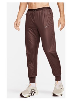 Męskie spodnie do biegania Storm-FIT Nike Running Division Phenom - Brązowy ze sklepu Nike poland w kategorii Spodnie męskie - zdjęcie 169758676