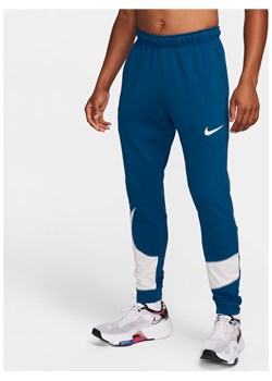 Męskie zwężane spodnie do fitnessu Nike Dri-FIT - Niebieski ze sklepu Nike poland w kategorii Spodnie męskie - zdjęcie 169758867