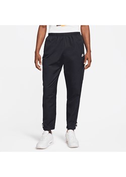 Męskie spodnie z tkaniny Nike Sportswear Repeat - Czerń ze sklepu Nike poland w kategorii Spodnie męskie - zdjęcie 169759095