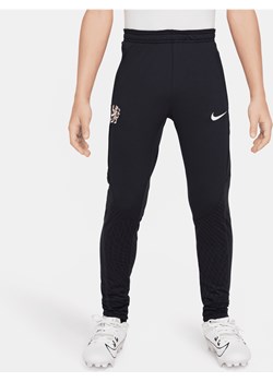 Spodnie piłkarskie dla dużych dzieci Nike Dri-FIT Chelsea F.C. Strike - Niebieski ze sklepu Nike poland w kategorii Spodnie chłopięce - zdjęcie 170057639