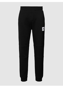 Spodnie dresowe o kroju regular fit z nadrukiem z logo ze sklepu Peek&Cloppenburg  w kategorii Spodnie męskie - zdjęcie 170174656