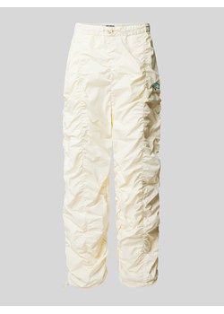 Spodnie o kroju baggy fit z marszczeniami ze sklepu Peek&Cloppenburg  w kategorii Spodnie męskie - zdjęcie 170254295