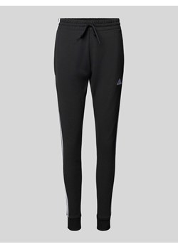 Spodnie dresowe o kroju slim fit z wyhaftowanym logo ze sklepu Peek&Cloppenburg  w kategorii Spodnie damskie - zdjęcie 170406835