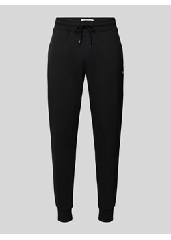 Spodnie dresowe o kroju slim fit z efektem melanżowym ze sklepu Peek&Cloppenburg  w kategorii Spodnie męskie - zdjęcie 170552075