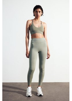 H & M - Sportowe legginsy DryMove z kieszonką - Zielony ze sklepu H&M w kategorii Spodnie damskie - zdjęcie 170635699