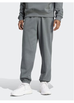 adidas Spodnie dresowe ALL SZN IW1187 Zielony Regular Fit ze sklepu MODIVO w kategorii Spodnie męskie - zdjęcie 170797578