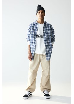 H & M - Spodnie spadochronowe Loose Fit - Beżowy ze sklepu H&M w kategorii Spodnie męskie - zdjęcie 170809818
